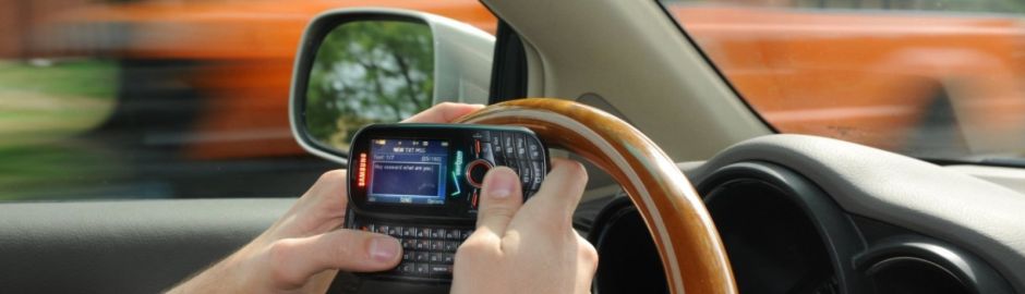 person texting while driving